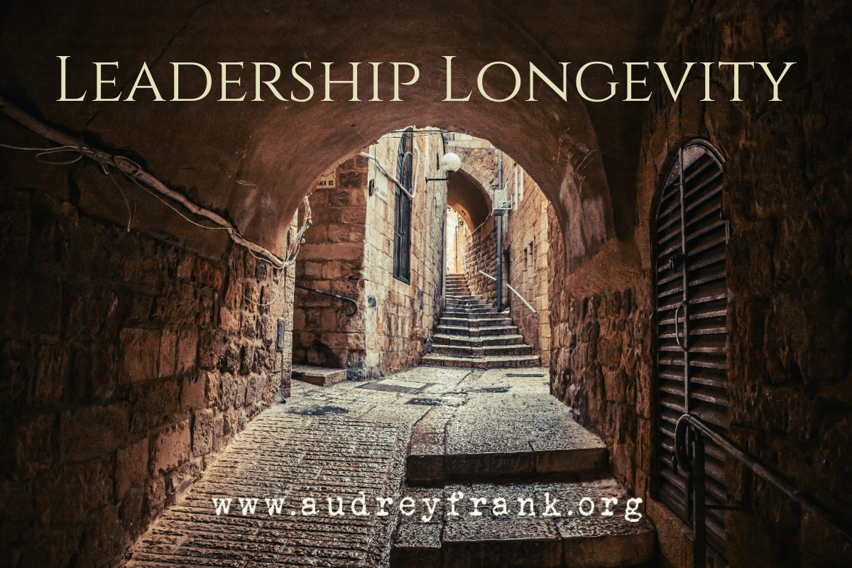 a street in the Jewish quarter of Jerusalem with the words Leadership Longevity describing the post.