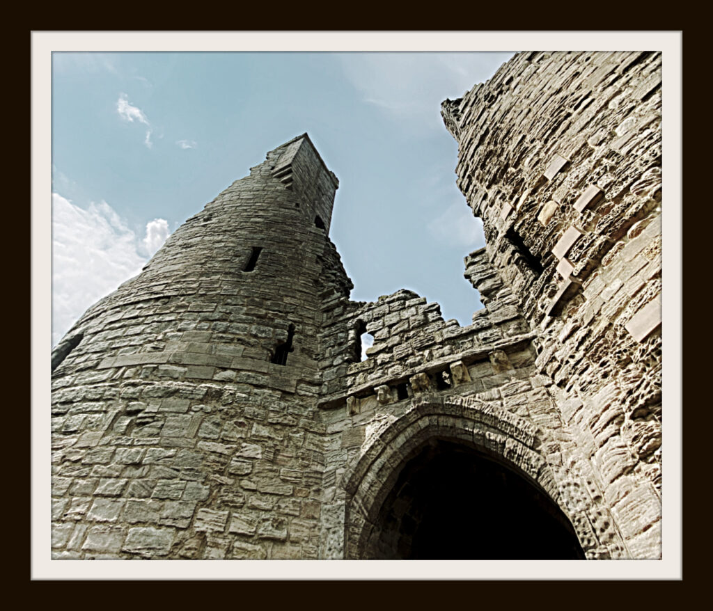 A picture of crumbling castle gate ruins with the poem title, What Will You Say?