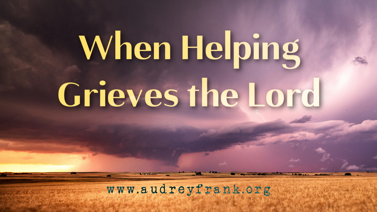 A storm over a harvest field with the words When Helping Grieves the Lord, describing the subject of the devotional.