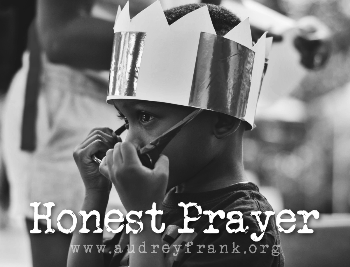 A photo of a little boy with a paper king's crown on, with the words, "honest prayer" describing the subject of the post.