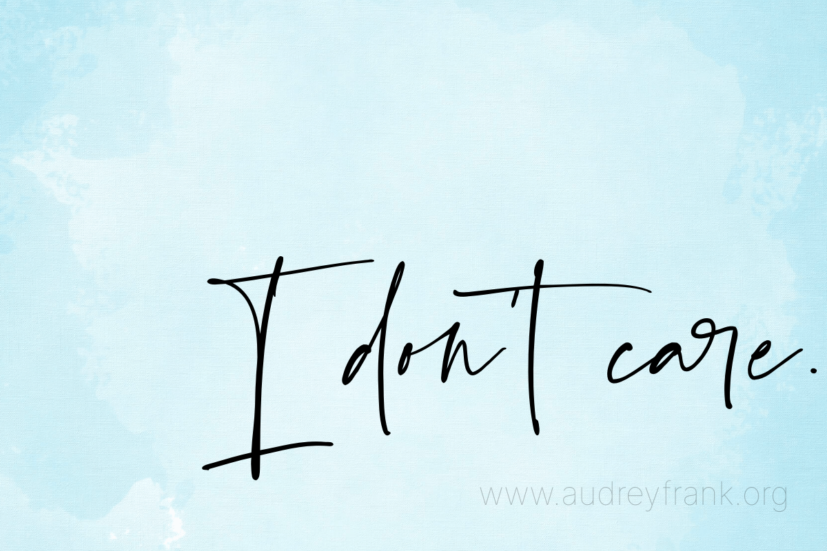 A blue watercolor background with the words, "I don't care" describing the subject of the post.